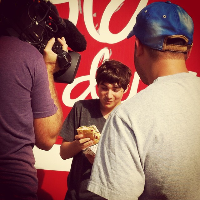 My son gearing up for his TV debut with a Hot Mess sandwich from LOLA Deux... at @lolanorthshore for Eat St. On @foodnetwork